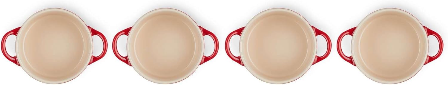 A charming trio of Le Creuset Miniature Round Casseroles in a stunning blue—so elegant, they almost steal the show. Perfectly sized for individual servings, they’re like little culinary treasures. Don’t you just want to dive in?