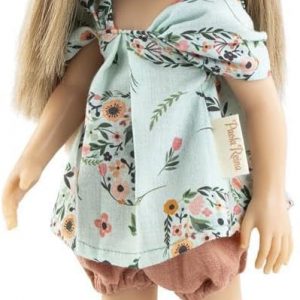 A Roxanne doll—oh, that long, flowing brown hair! She’s dressed in a cute pink number, complete with matching kicks. The whole vibe against the crisp white backdrop just pops. Such a classic look, really.