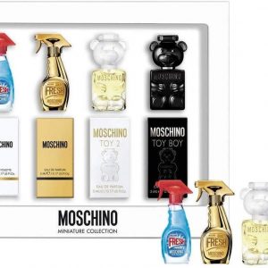 A chic lineup of Moschino's tiny fragrance bottles, all dressed up in eye-catching designs. They’re perfectly arranged, showcasing the playful style that Moschino is known for—each little bottle has its own charm, ready to add a splash of fun to any collection.