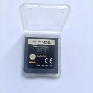 Resident Evil: Deadly Silence game cartridge—Nintendo DS. Just look at that iconic logo! Zombies lurking, characters in a creepy, dark atmosphere. It's all there, waiting for you to dive into the madness.