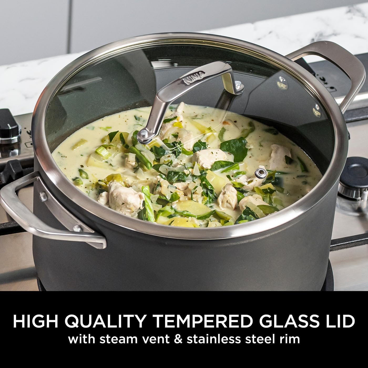 28cm Ninja wok—sleek grey finish, which is kinda cool, right? It's got a non-stick surface perfect for easy cooking (and even easier cleaning). Plus, the glass lid with a steam vent? Genius. All set against a crisp white backdrop.