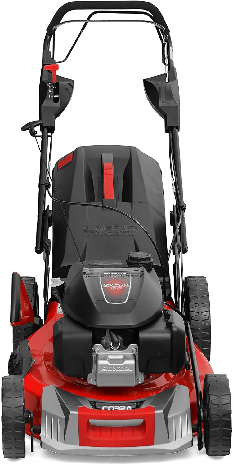 Cobra MX534SPH lawn mower—gas-powered beast, metal deck, and a seriously big grass bag. It's right there on the green, ready to tackle your wild backyard.