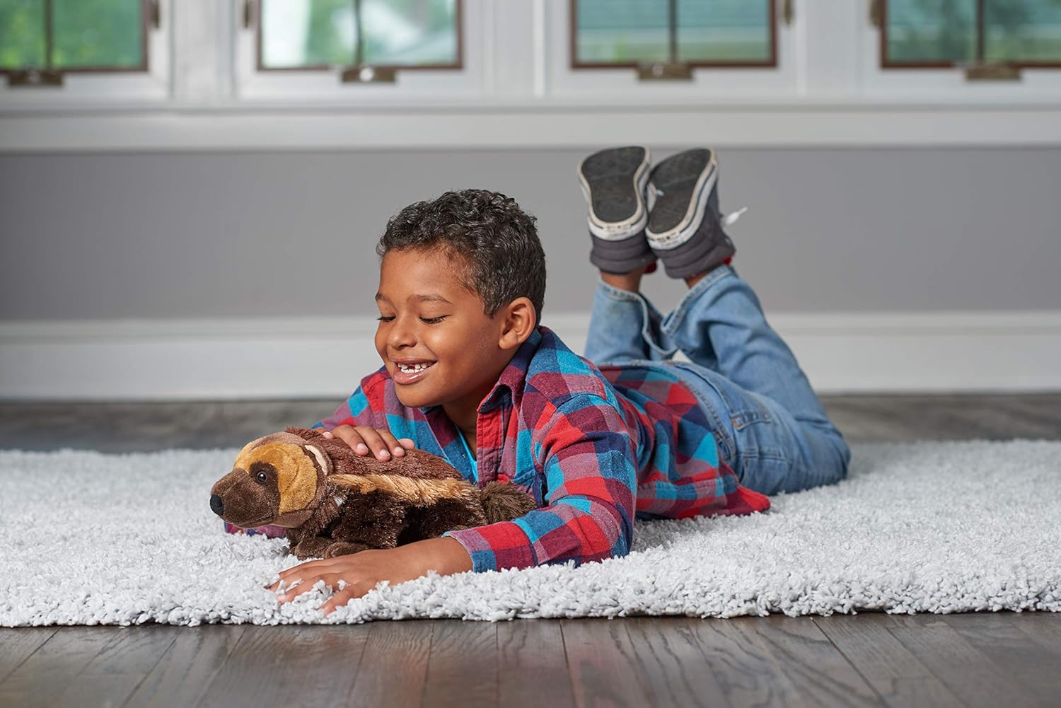 A super cuddly brown wolverine plush, just chillin' against a plain backdrop. You can see its fluffy fur—so soft, and those little details? Spot on! Perfect for snuggling or just adding some wild vibes to any room.