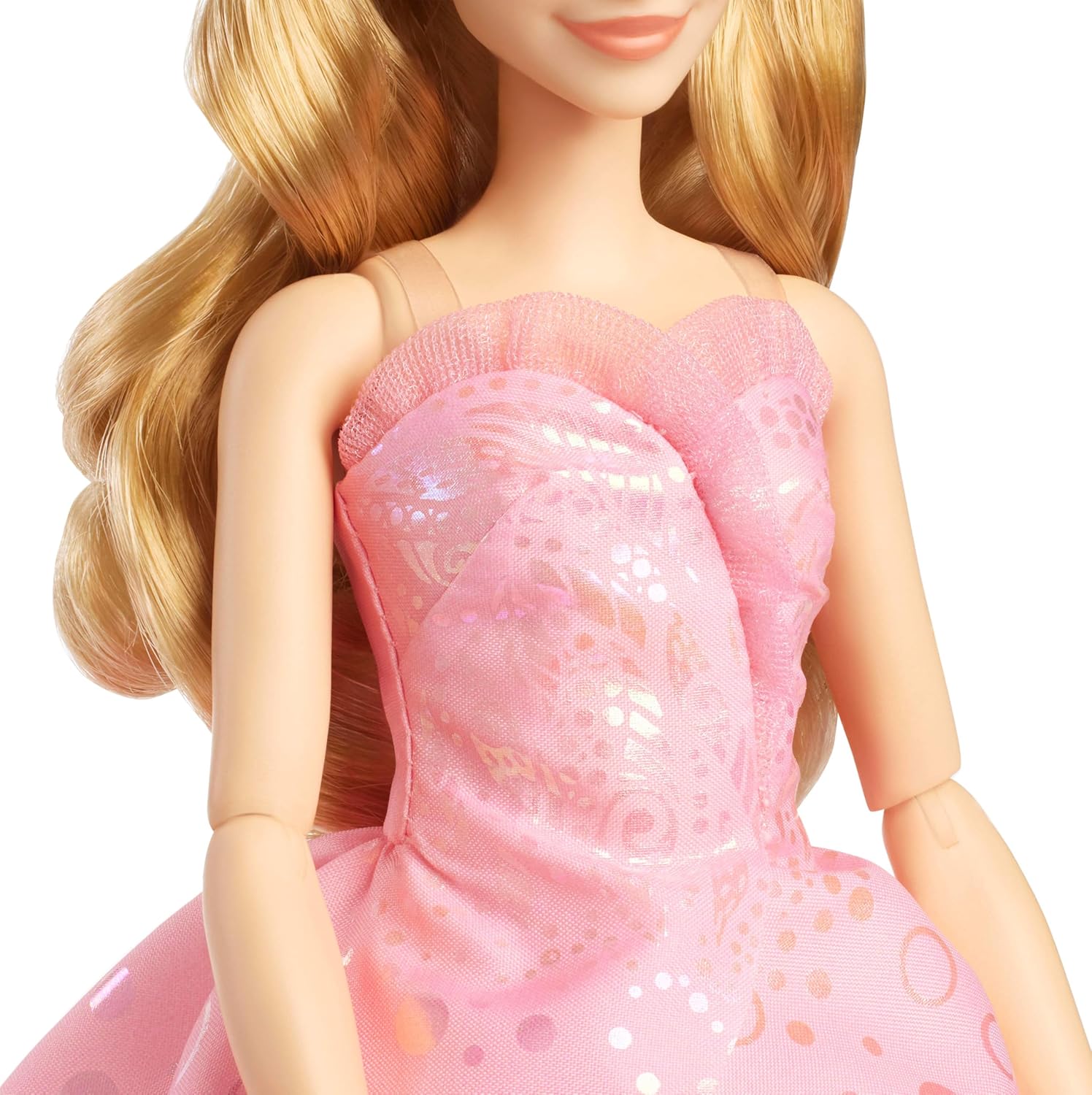 Glinda Deluxe Doll, decked out in a poofy pink ballgown—so many layers! She’s got a sparkly tiara perched on her head, wand in hand, looking every bit the fairy queen. Beautifully presented on a stand, making sure she steals the spotlight against that crisp white backdrop.