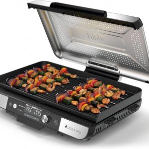 Sleek silver and black Ninja Sizzle XL grill—big cooking surface, detachable lid. Perfect for indoor grilling, looks sharp on the counter.