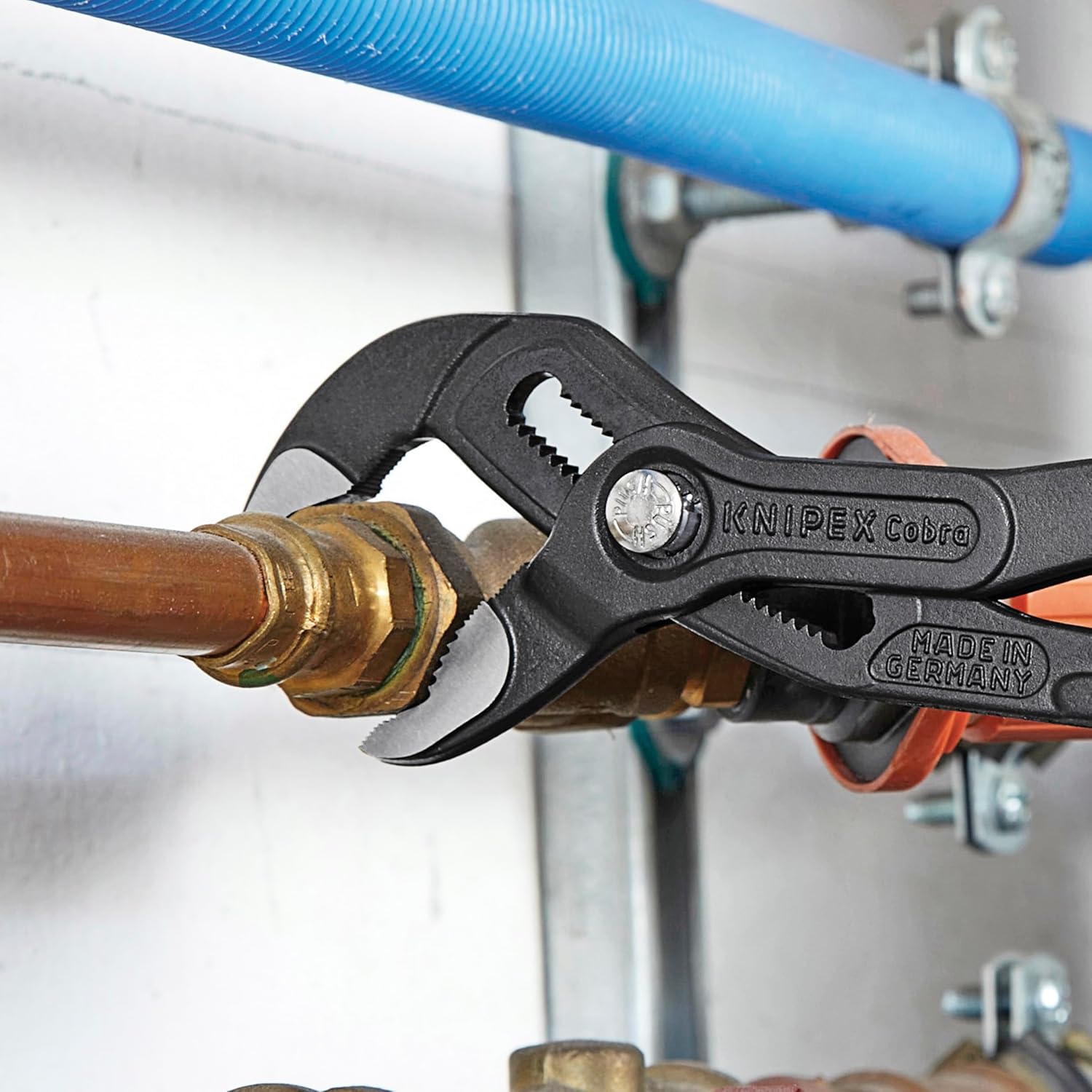 Knipex Cobra Pliers featuring those eye-catching red grips—seriously, who doesn’t love a pop of colour?—show off a sleek, tough alloy steel design and teeth that grip like nobody's business. Perfect for tackling those tricky jobs, you know?