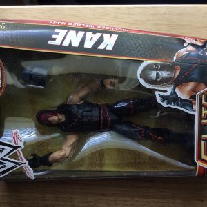 Kane figure striking an epic pose—just look at that detail! His classic outfit really pops against a simple backdrop. You can practically feel the intensity radiating from him, yeah?