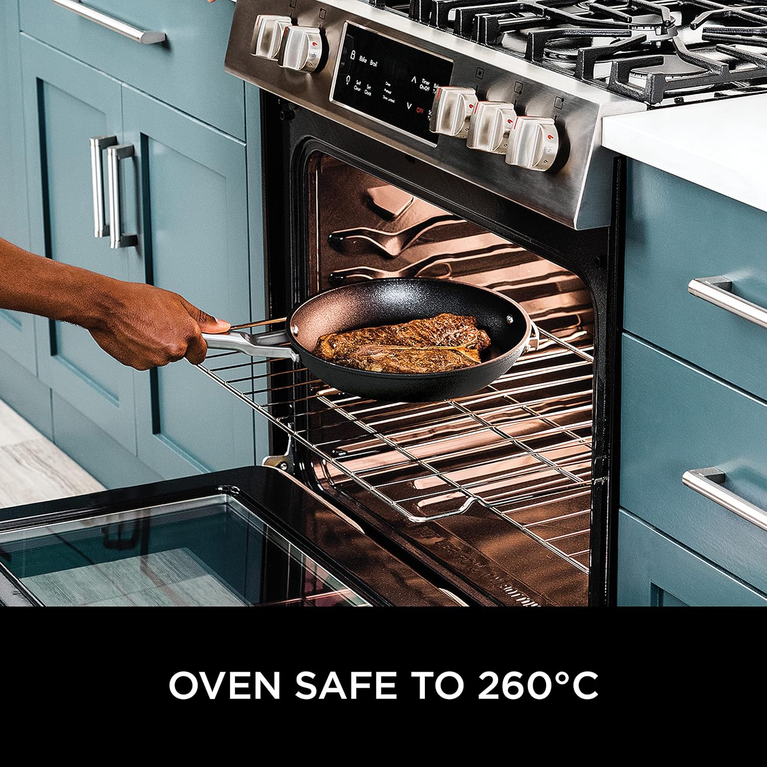 Ninja Stackable cookware set—grey hard-anodised aluminium saucepans, frying pans, and those cool glass lids, all sitting pretty on a lively kitchen countertop. It's like a cooking party in there.